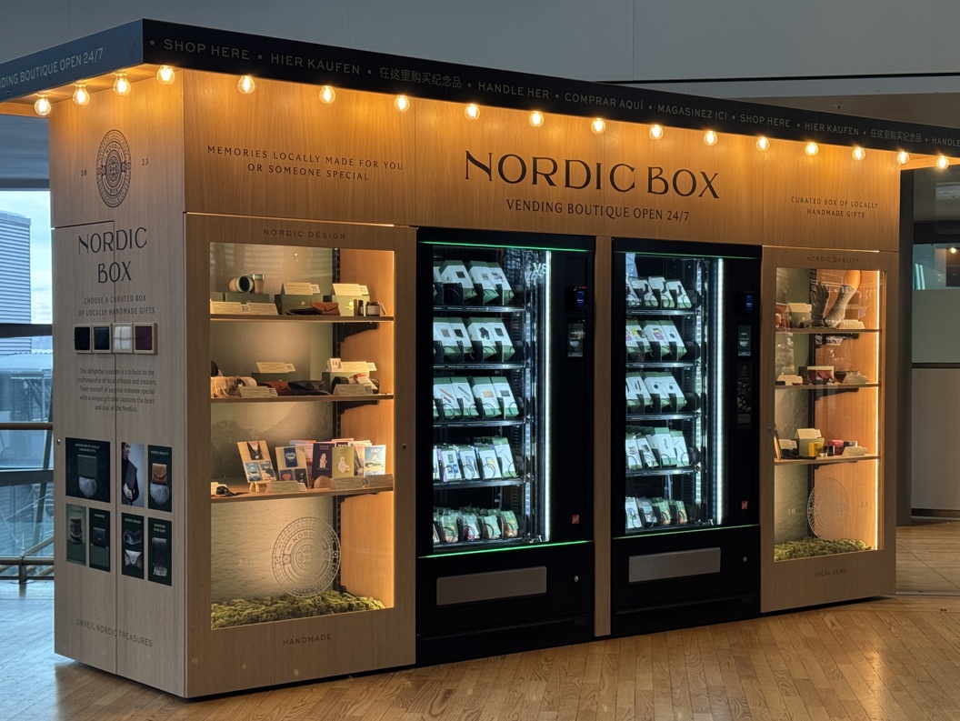 Nordic Box vending boutique with illuminated shelves and vending machines showcasing locally handmade gifts, located in a modern indoor setting