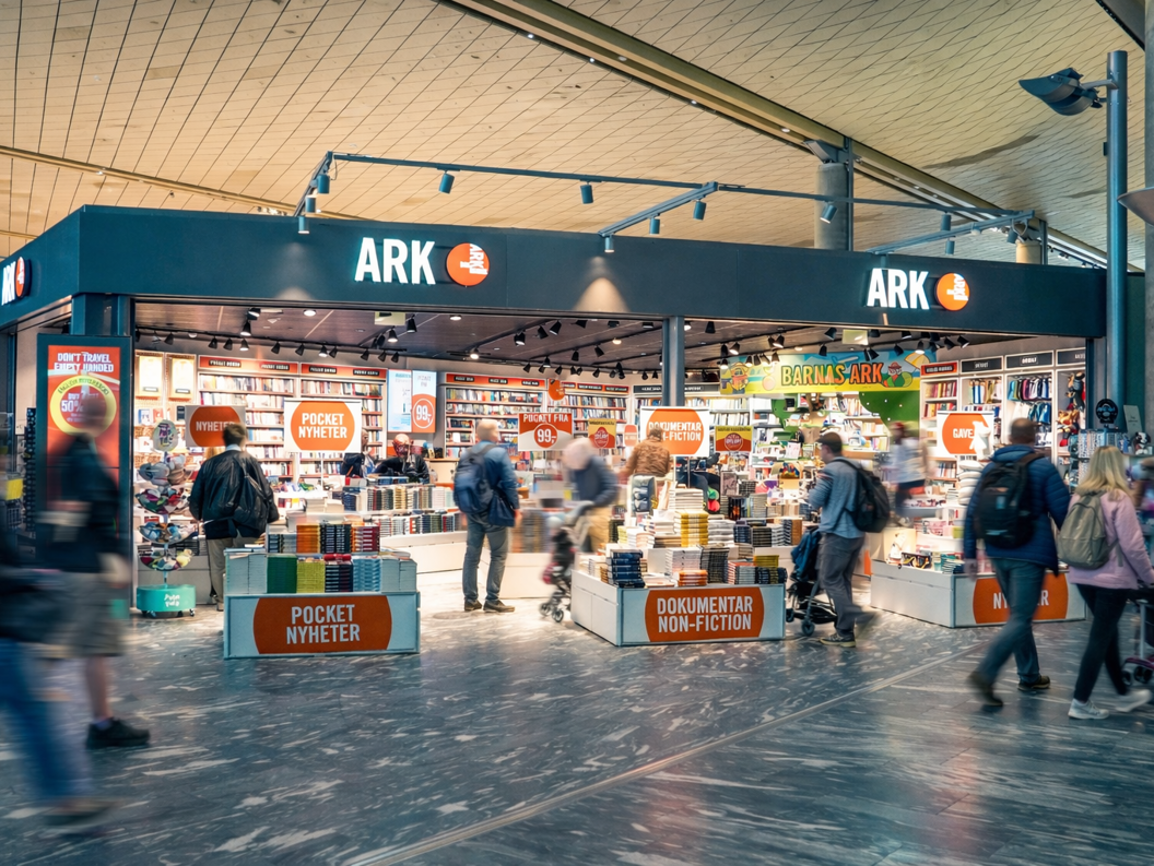 Woman browsing colorful children's books on a bookstore shelf